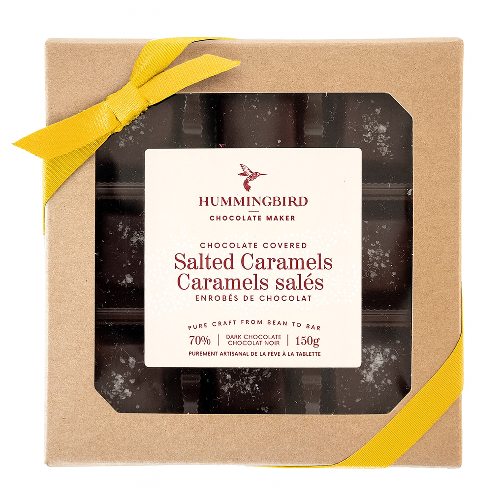 Box of Hummingbird Chocolate Covered Salted Caramels with a yellow ribbon on a white background