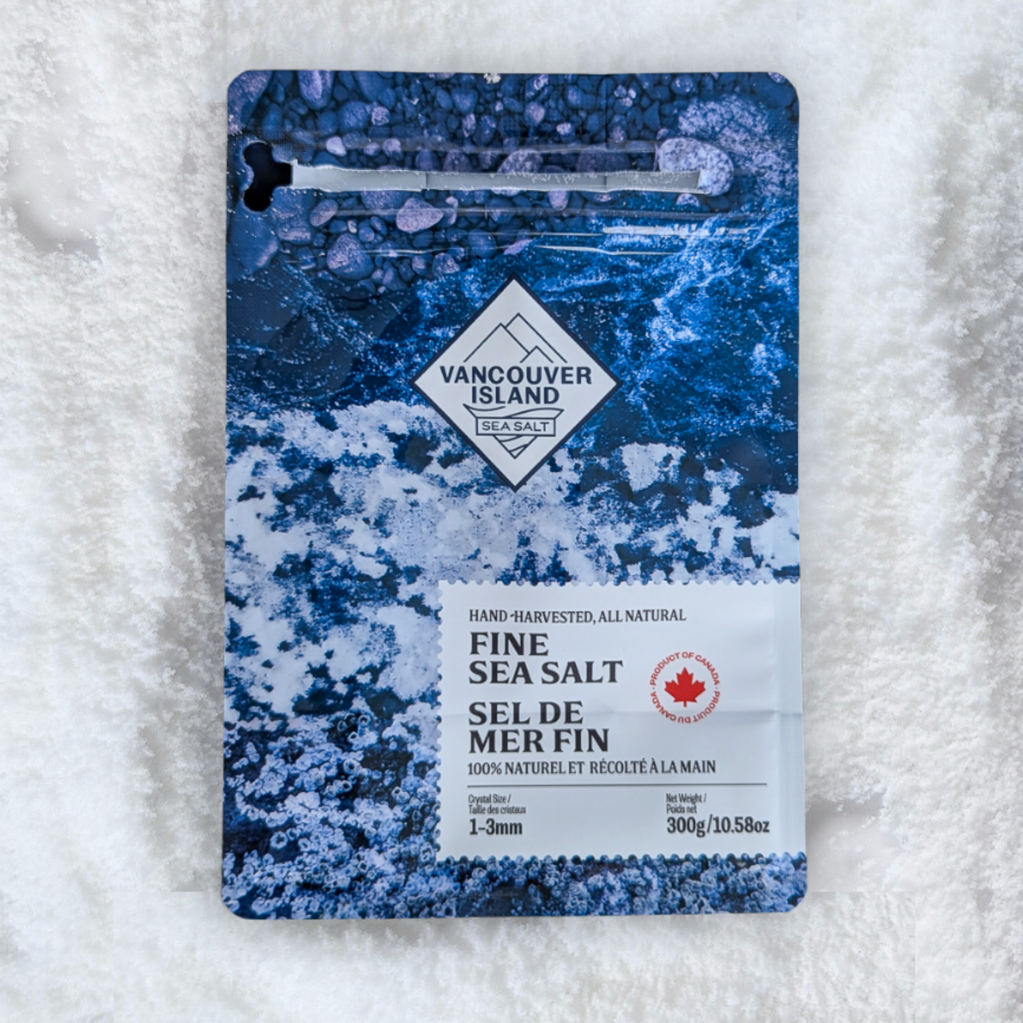 Vancouver Island Fine Sea Salt package on a bed of salt crystals